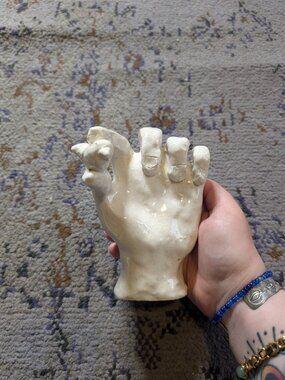 Handmade Pottery Sculpture of Hand Holding Small Bird in Off White